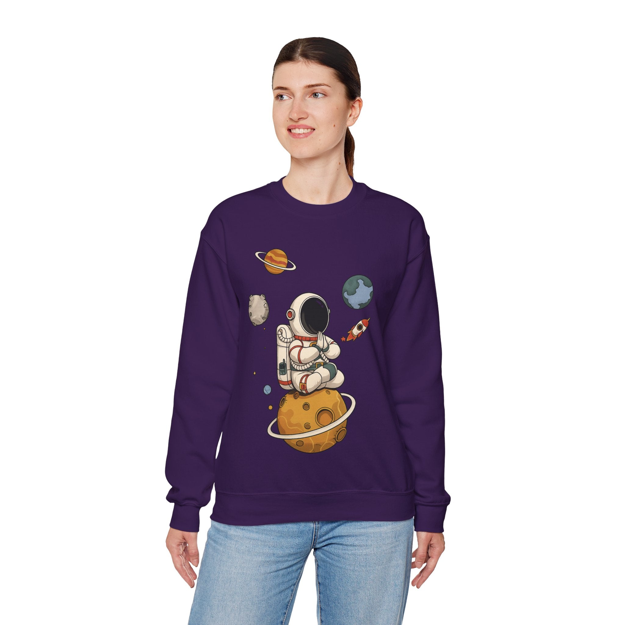Astronaut Sitting on Planet Crewneck Sweatshirt – Cute Space Explorer Graphic